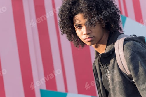 Preview: african american teenager walking on the street