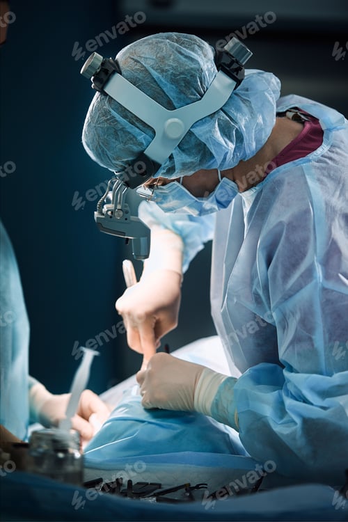 Preview: Surgical team in the operating room, close-up. An international team of professional doctors in a