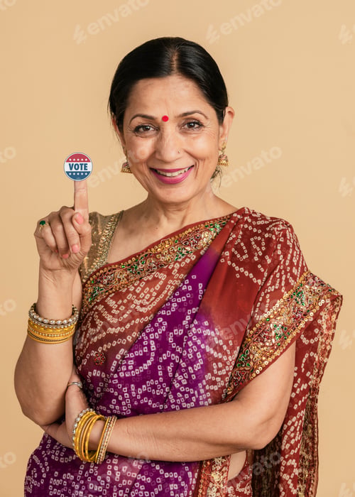 Preview: Indian woman showing a vote sticker