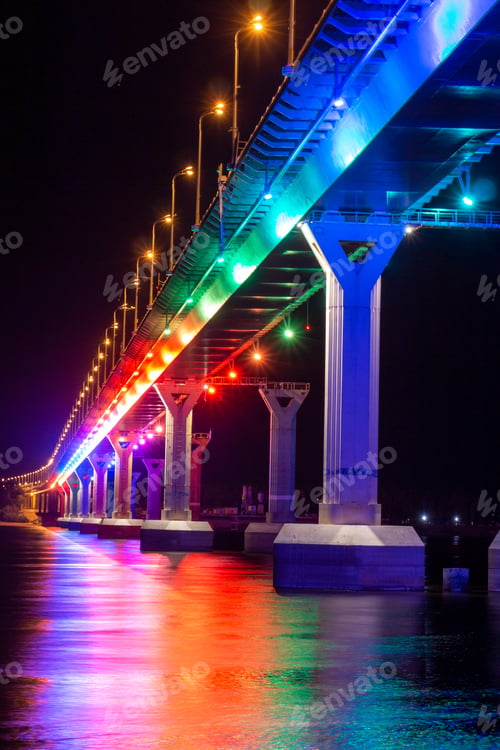 Multi-colored bridge at night