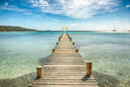 Preview: Astonishing landscape with wooden pier on Santa Giulia beach.