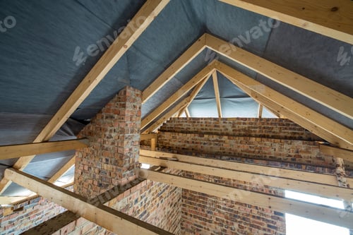 Preview: Attic space of a building under construction with wooden beams of a roof structure and brick walls