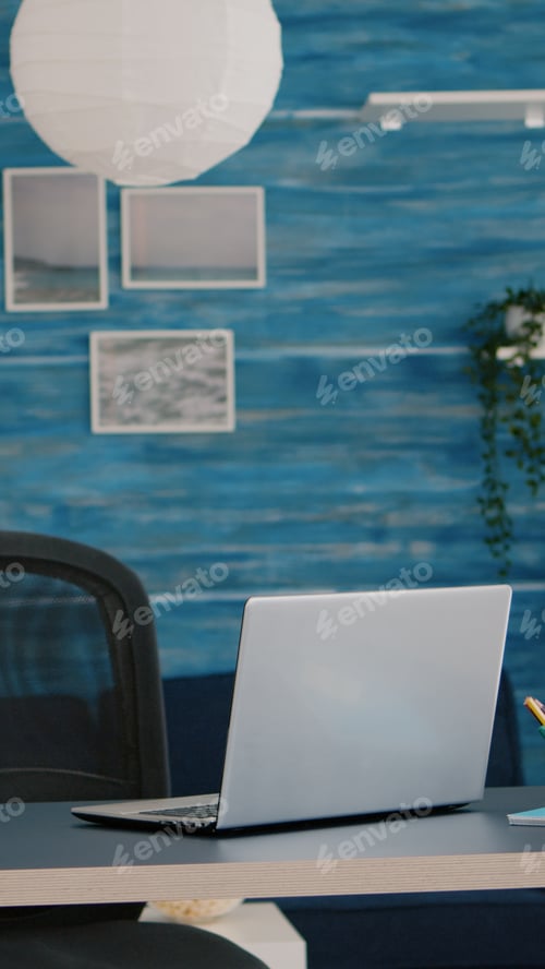 Preview: Laptop on Desk in Blue Modern Office