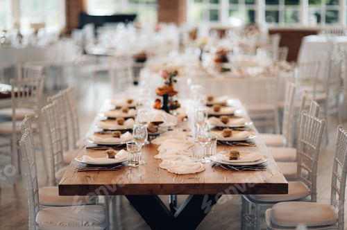 Preview: Beautiful wedding table setup with vibrant floral decorations.