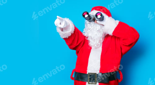 Preview: Funny Santa Claus have a fun with binoculars