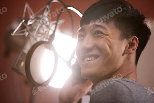 Preview: Young man singing in recording studio