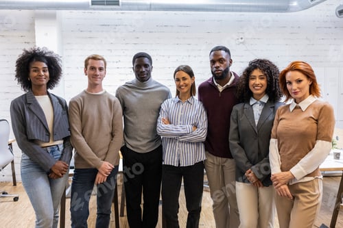Preview: Diverse business team smiling together in modern office