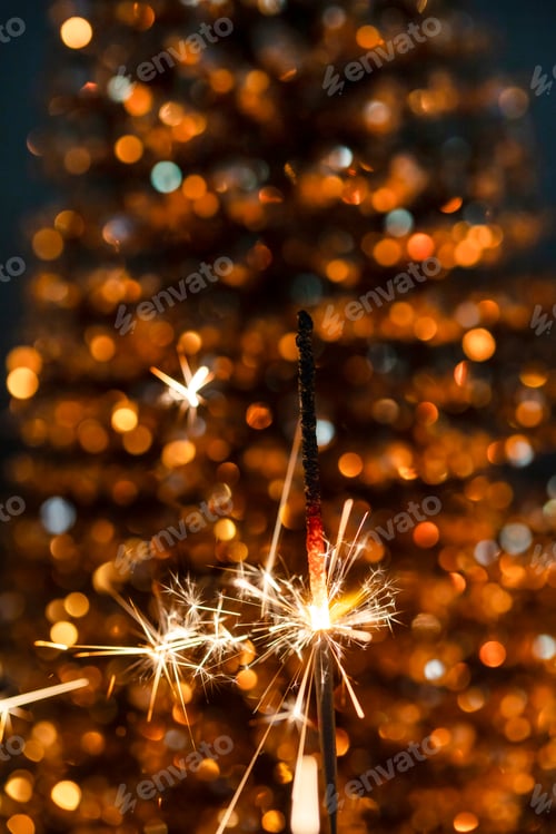 Preview: Christmas bengal fire sparkles against the black background.