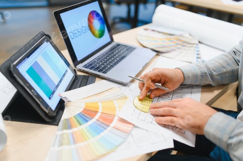 Preview: Interior designer working on floor plans with color palette