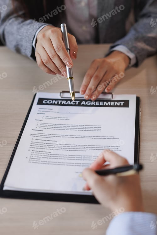 Preview: Businesswoman giving pen to client for signing contract agreement