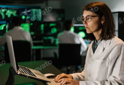 Preview: Female scientific research working on laptop computer in laboratory