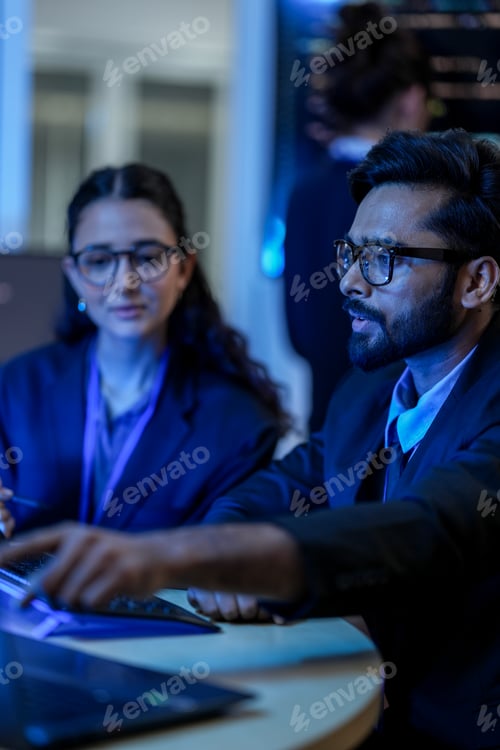 Preview: diverse team of AI developers collaborates on a night coding session.