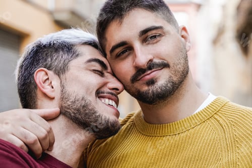 Preview: Gay male couple having tender moment outdoor in the city - LGBT love concept