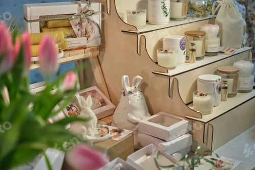 Preview: beautiful market stall filled with handcrafted items at a seasonal fair. Springtime events and