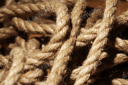Preview: Old rope over wooden surface