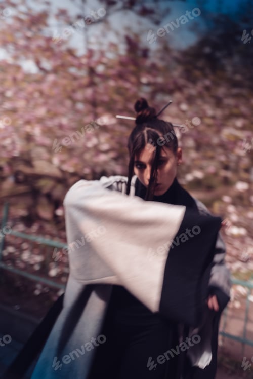 Preview: Beautiful young woman wearing kimono with cherry blossoms, sakura view
