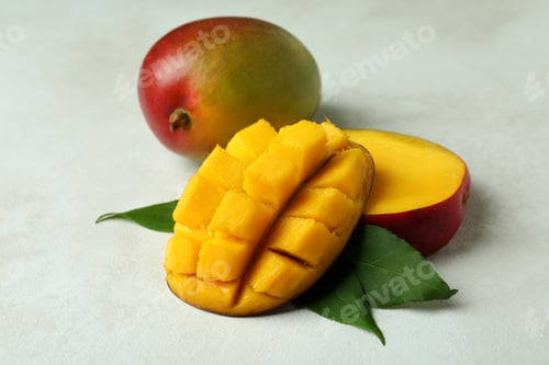 Preview: Tasty ripe mango fruit on white textured background