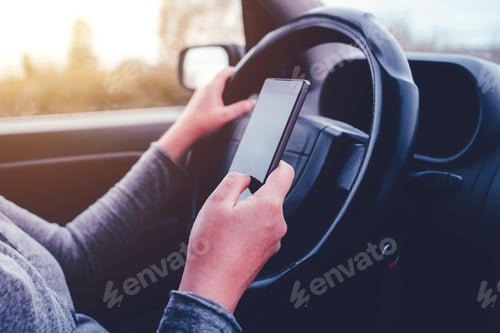 Preview: Woman simultaneously driving car and reading text message