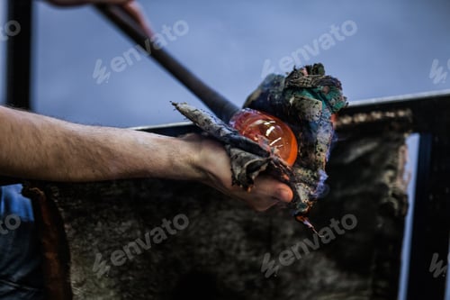 Preview: Man Hands Closeup Working on a Blown Glass Piece