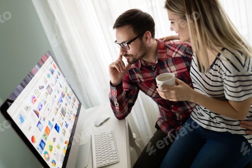 Preview: Young attractive designers working together from home