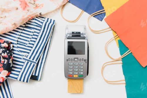 Preview: Close up of hand using credit card swiping machine to pay. credit card payment through a terminal