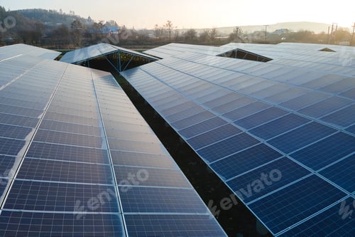 Preview: Aerial view of large sustainable electrical power plant with rows of solar photovoltaic panels