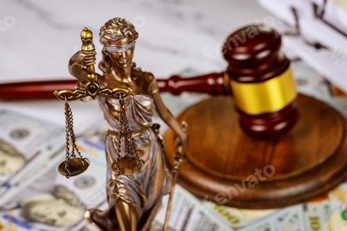Preview: Judge's gavel with books and statue of Justice scales on law office working law document