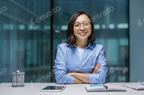 Preview: Confident businesswoman with a smile in modern office setting