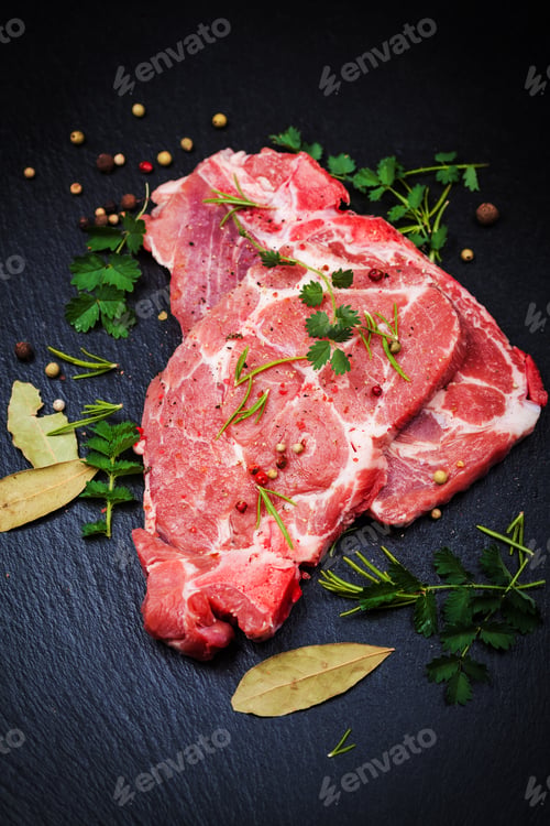Preview: Fresh raw pork meat on black board