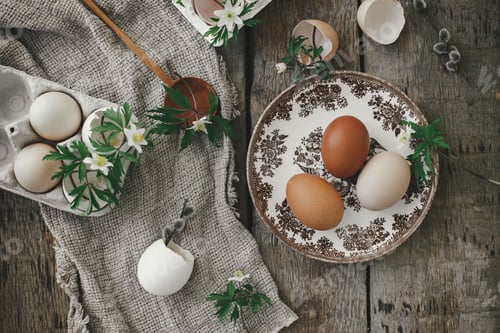 Preview: Easter rustic still life. Natural easter eggs, blooming spring flowers, burlap flat lay