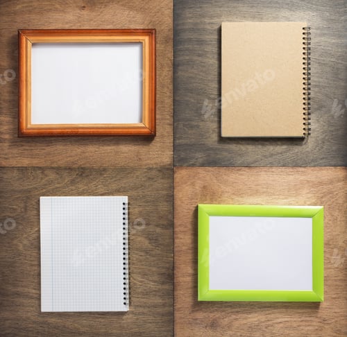 Preview: checked notebook and picture frame at wooden background