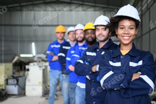 Preview: Group of confident worker team at factory