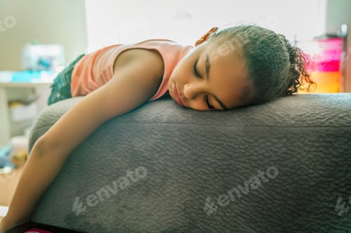 Preview: Bored mixed-race girl pouting on couch