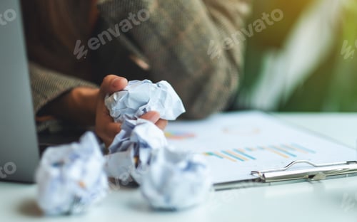 Preview: Closeup image of a businessman get stressed and screwed up papers while working in the office