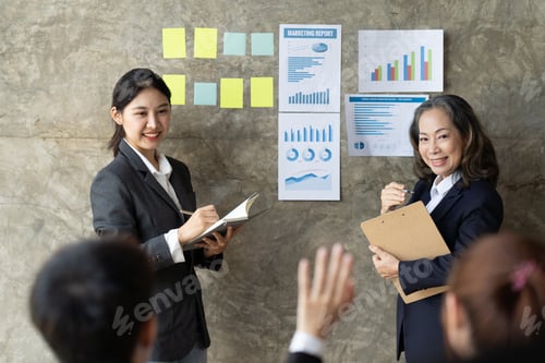 Preview: Confident female manager presenting financial report speak at team meeting talk to employees group,