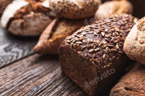 Preview: Delicious fresh bread on wooden background