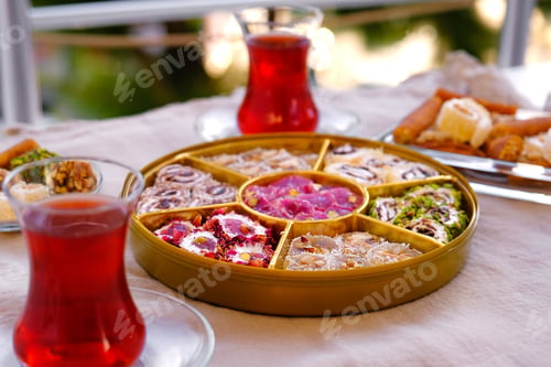 Preview: Tasty traditional Turkish delight, dessert sweets lokum, muska on wooden cutting board