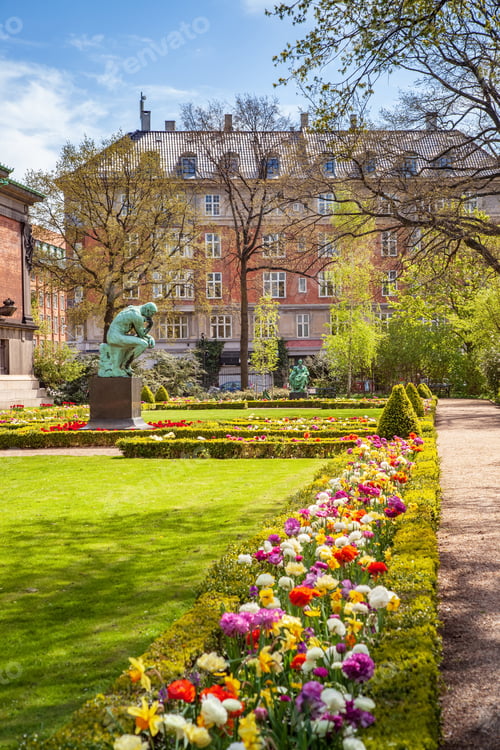 Preview: Urban scene with city park with flowers and monument in Copenhagen, denmark