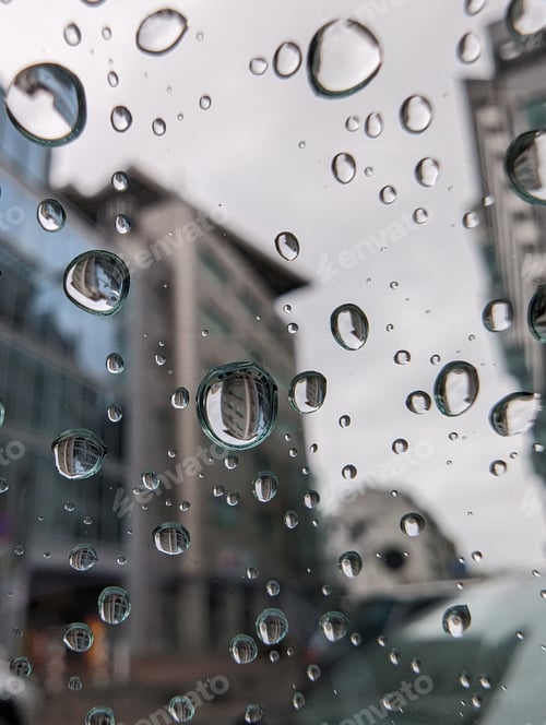 Preview: Closeup shot of water droplets running down the window from the inside of the vehicle.