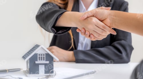 Preview: Real estate agents sale broker and buyers handshake after signing a business contract at home office