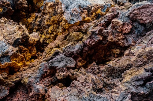 Preview: Detail of the red and yellow colors in the volcanic stones in Charco Manso on the island El Hierro
