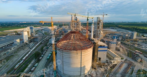 Preview: Aerial view of cement factory under construction with high concrete plant structure