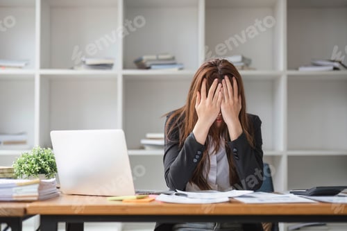 Preview: A stressed and serious young Asian businesswoman focuses on working on her business financial