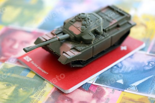 Preview: Swiss franc banknotes and toy tank on passport. The current francs money bills and tank on pass