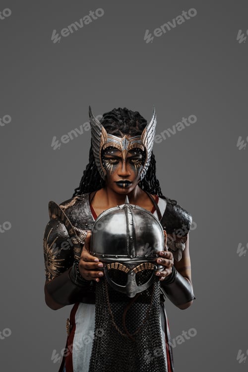 Preview: Attractive black woman warrior holding helmet staring at camera
