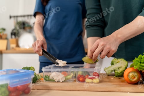 Preview: Close up of new marriage couple spend time together in kitchen at home.