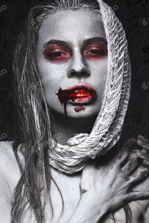 Preview: Girl in form of zombies, Halloween corpse with blood on his lips. Image for a horror film.