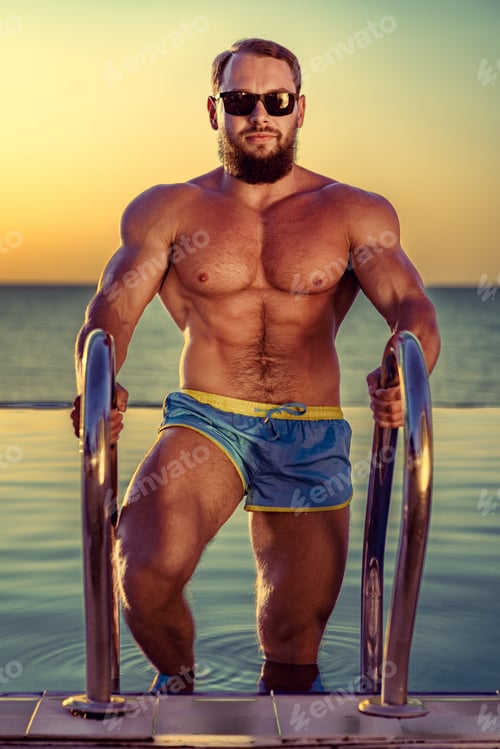 Preview: Fit man bodybuilder coming out of pool