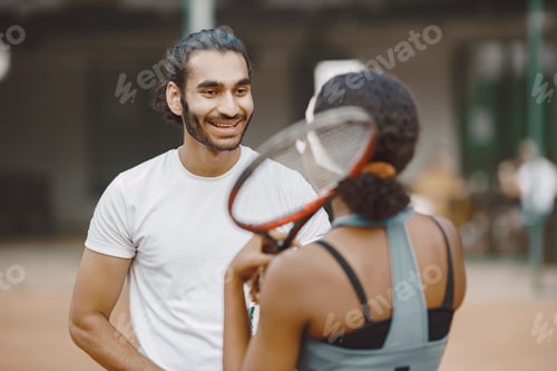 Preview: Two tennis players talking on a tennis court before the match