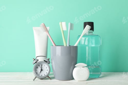 Preview: Tools for dental care on mint background, close up